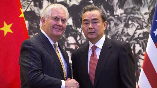 U.S. Secretary of State Rex Tillerson and Chinese Foreign Minister Wang Yi shake hands at the end of a joint press conference at the Diaoyutai State Guesthouse in Beijing, China, March 18, 2017. 