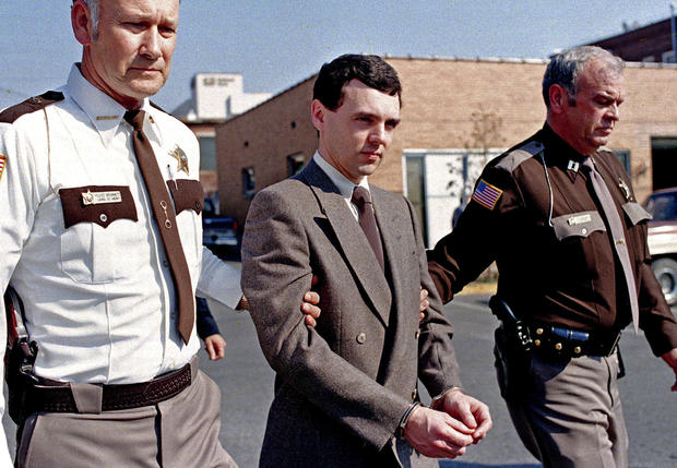 Convicted killer Donald Harvey, center, is led back to jail by Laurel County, Ky., Sheriff Floyd Brummett, left, and an unidentified deputy after pleading guilty to eight murder charges and one voluntary manslaughter charge in London, Ky., on Nov. 2, 198 