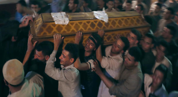 Mourners carry a coffin at the funeral of Coptic Christians who were killed in Minya, Egypt, May 26, 2017. 