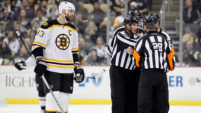 dl-zdeno-chara-with-referees-during-offside-goal-review.jpg 