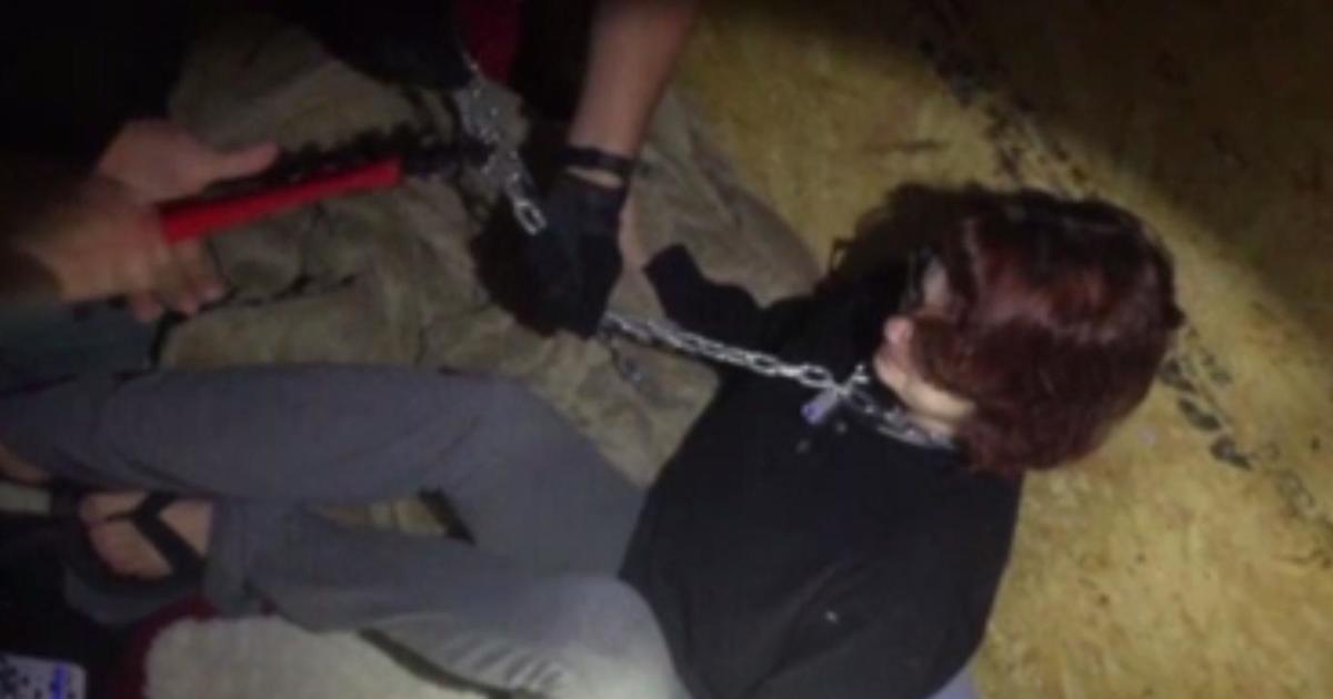 Chilling video shows rescue of missing woman "chained like a dog" - CBS News
