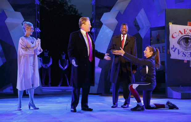 Tina Benko, left, portrays Melania Trump in the role of Caesar's wife, Calpurnia, and Gregg Henry, center left, portrays President Trump in the role of Julius Caesar during a dress rehearsal of The Public Theater's Free Shakespeare in the Park production 