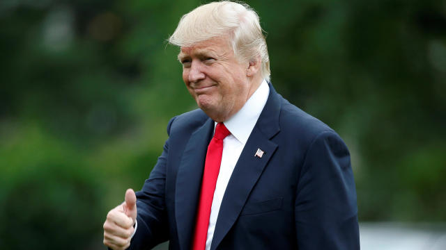 President Trump gives a thumbs-up as he returns from a day trip to Ohio at the White House in Washington June 7, 2017. 