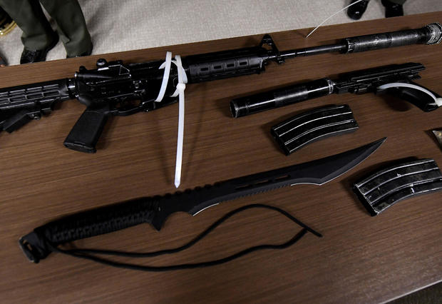 Los Angeles County sheriff's deputies show the media, during a press conference in Los Angeles, the weapons seized after they arrested a man at the Sierra Madre Metro train station in Pasadena, California, on June 21, 2017. 