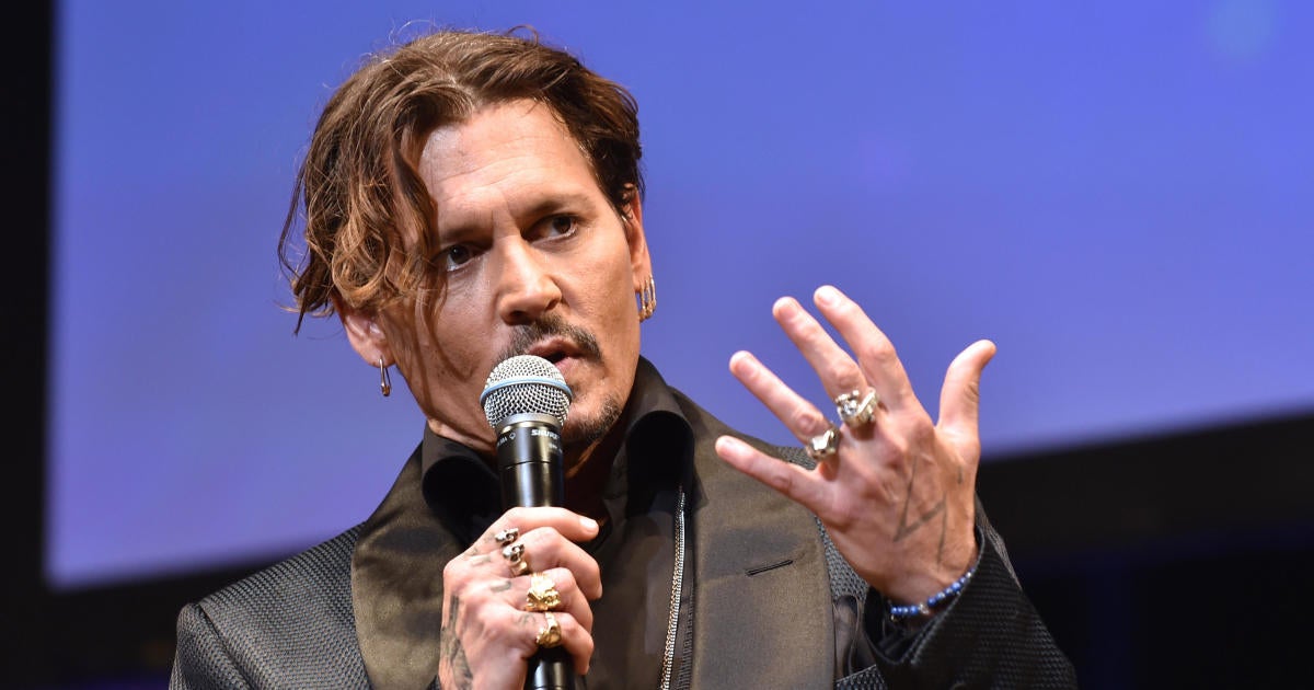 Johnny Depp Settles 25m Lawsuit Against The Management Group Cbs News