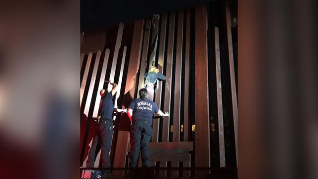 woman-rescued-border-fence.jpg 