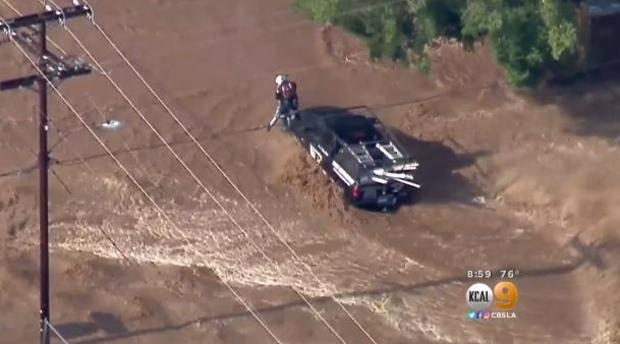 Several drivers were trapped and rescued after heavy rain flooded a Southern California neighborhood on Aug. 3, 2017. 