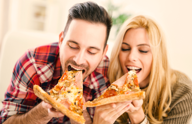 Couple eating pizza 