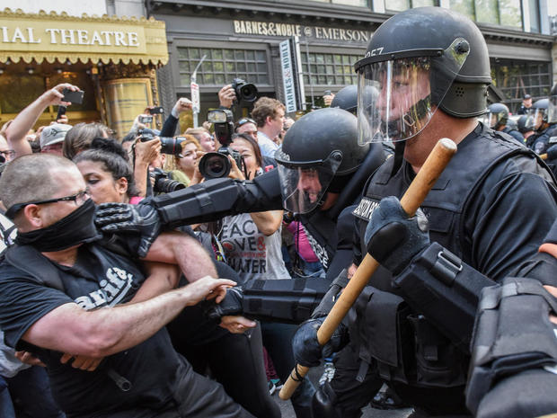 Counter protesters clash with Boston Police outside of the Boston Commons and the Boston Free Speech Rally in Boston, Massachusetts 