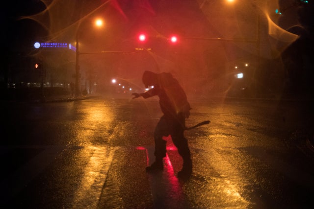 Stewart Adams, of San Marcos, Texas, plays in the winds from Hurricane Harvey in Corpus Christi, Texas, 