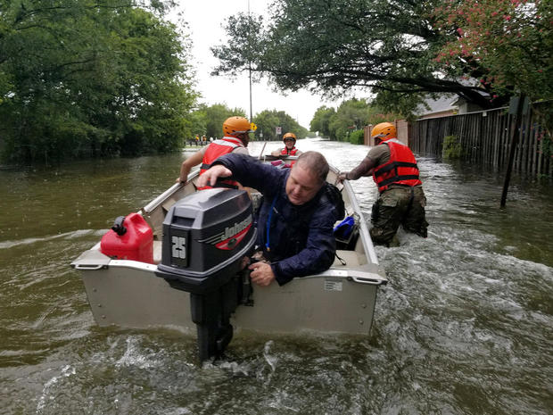 Handout photo of Texas National Guard soldiers search by boat for stranded residents in heavily flooded areas from the storms of Hurricane Harvey in Houston 