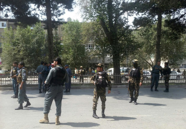 Afghan security forces keep watch at the site of attack in Kabul 