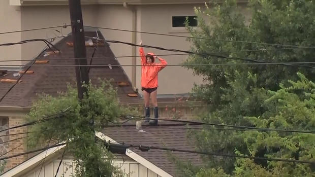 Person on rooftop during Hurricane Harvey 