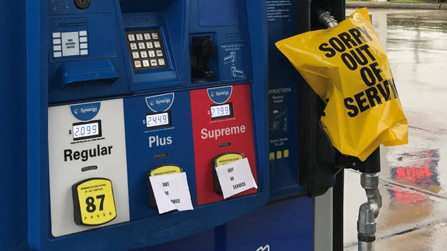 A gas pump is covered with an out of service message as fuel ran out ahead of Hurricane Harvey's arrival near the Texas coastal area, in Houston 