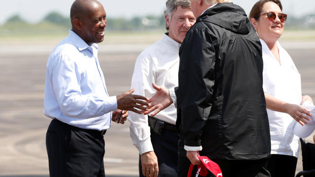 U.S. President Donald Trump greets Houston Mayor Sylvester Turner after arriving at Ellington Field in Houston 