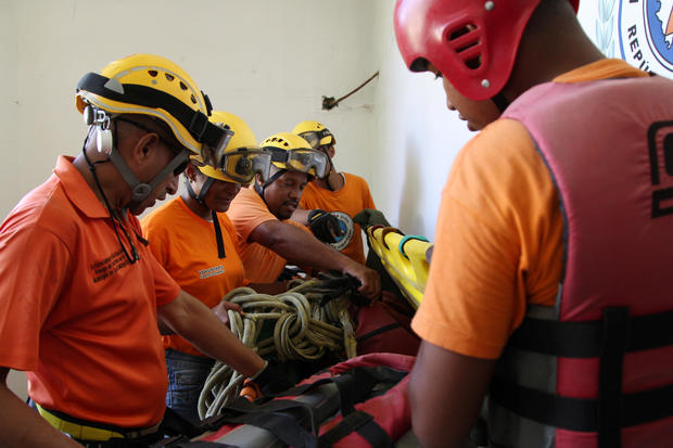 Members of the Civil Defense prepare their gear ahead of Hurricane Irma, in Santo Domingo 