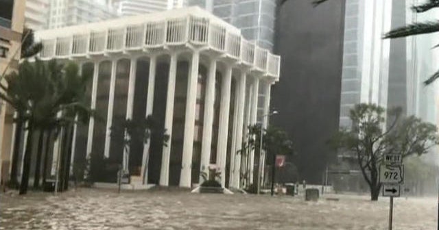 Storm surge and high winds hit downtown Miami - CBS News