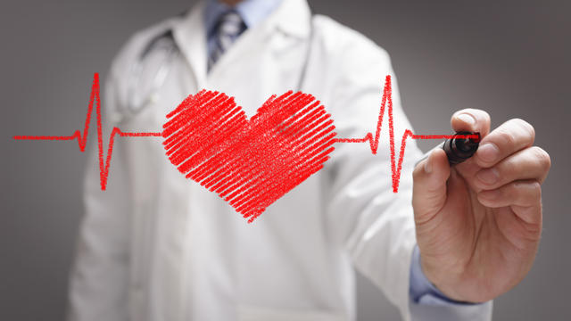 Doctor drawing ecg heartbeat chart 
