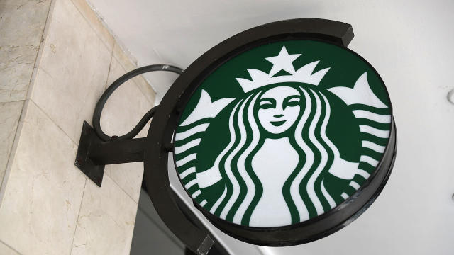 A Starbucks sign is seen at one of their stores on July 28, 2017, in Miami, Florida. 