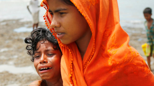 A Rohingya refugee girl cries as she arrives in Teknaf, Bangladesh, after crossing the Bangladesh-Myanmar border by boat through Bay of Bengal Sept. 14, 2017. 