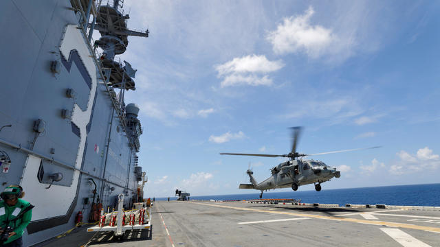 A Navy MH-60S Sea Hawk lifts off from the flight deck of the USS Kearsarge as U.S. military continues to evacuate from the U.S. Virgin Islands in advance of Hurricane Maria 