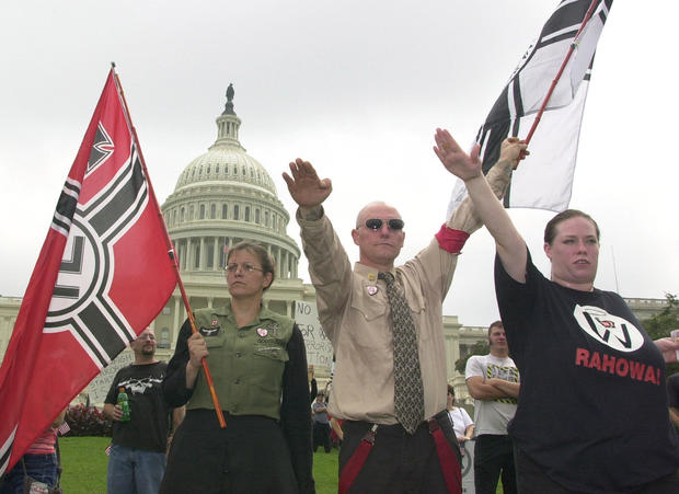 Members of the neo-Nazi National Alliance salute a 