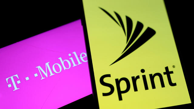 FILE PHOTO:    Smartphones with the logos of T-Mobile and Sprint are seen in this illustration 