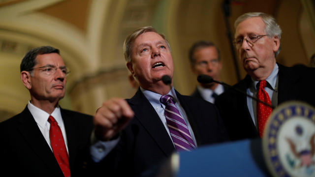 Sen. Lindsey Graham (R-SC) speaks with reporters following the party luncheons on Capitol Hill in Washington 