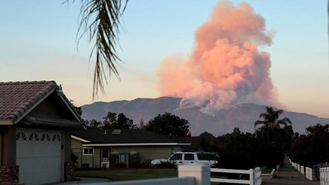 The Canyon Fire burns hillsides in Corona, California 