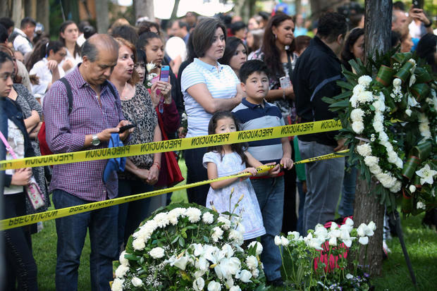Family members and friends of children and grown-ups who died after their school collapsed in an earthquake attend a Mass in Mexico City, Mexico, Sept. 24, 2017. 