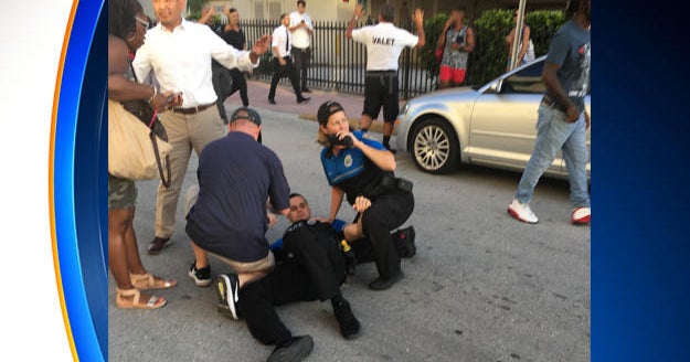 Woman in BMW shot dead after allegedly striking Miami Beach officer ...