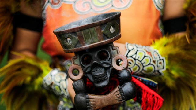A reveller performs during a "pow-wow" celebrating the Indigenous Peoples Day Festival on Randall's Island in New York Oct. 8, 2017. 
