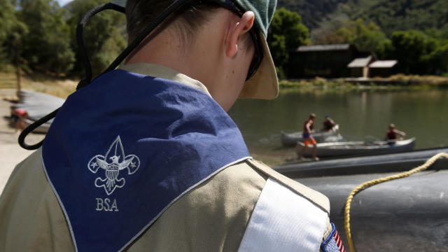 A Boy Scout works on a canoe at camp Maple Dell on July 31, 2015, outside Payson, Utah. 