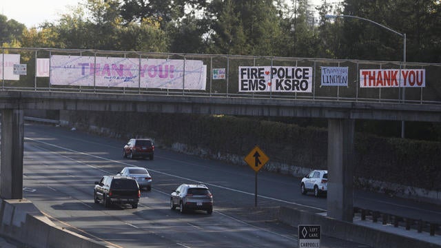 Thank you banners to responders are hung above Highway 101 after wildfires tore through portions of Santa Rosa 