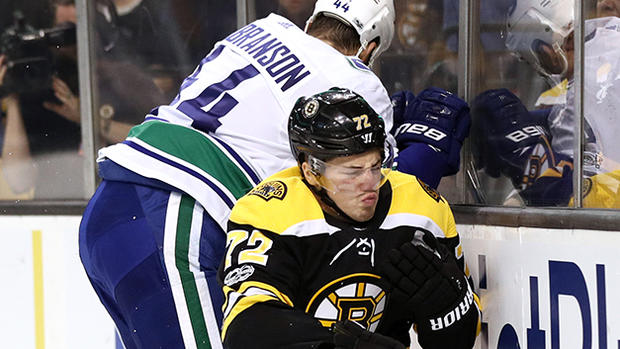 Erik Gudbranson hits Frank Vatrano - Vancouver Canucks v Boston Bruins 