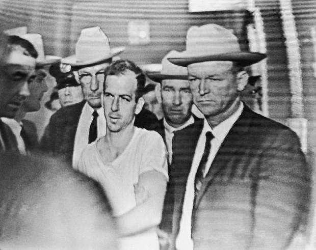 Guards Escorting Oswald After His Arrest 
