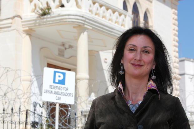 Maltese investigative journalist Daphne Caruana Galizia poses outside the Libyan Embassy in Valletta 