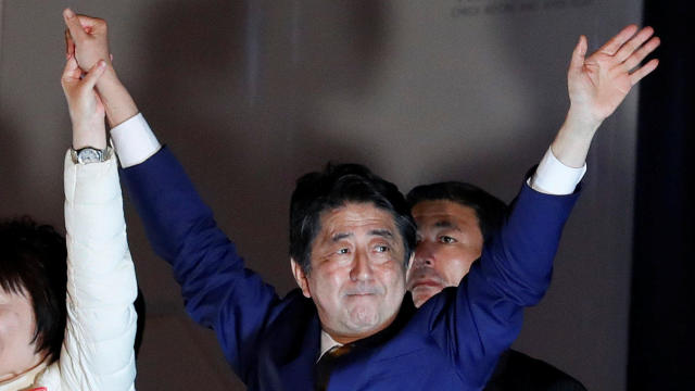 Japan's Prime Minister Shinzo Abe, leader of the Liberal Democratic Party, gestures at an election campaign rally in Tokyo 