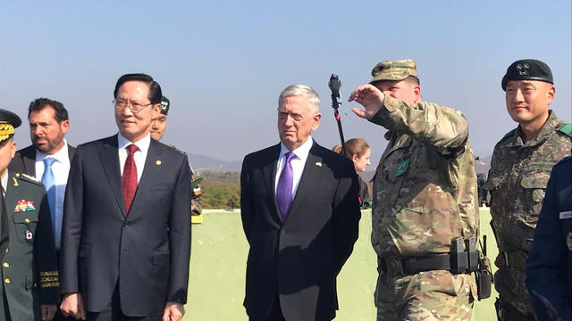 U.S. Defense Secretary Jim Mattis and his South Korean counterpart Song Young-moo peer into North Korea from Observation Post Ouellette in the demilitarized zone separating North and South Korea 