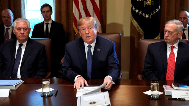U.S. President Donald Trump speaks during a cabinet meeting, flanked by Secretary of State Rex Tillerson and Secretary of Defense James Mattis, at the White House in Washington 