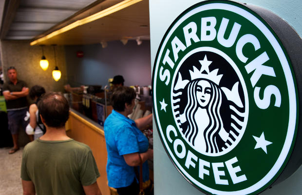 Customers queue for coffee at Starbucks 
