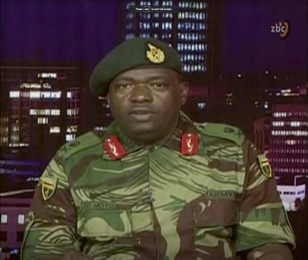 Zimbabwe Defence Forces Major-General Moyo makes an announcement on state broadcaster ZBC 