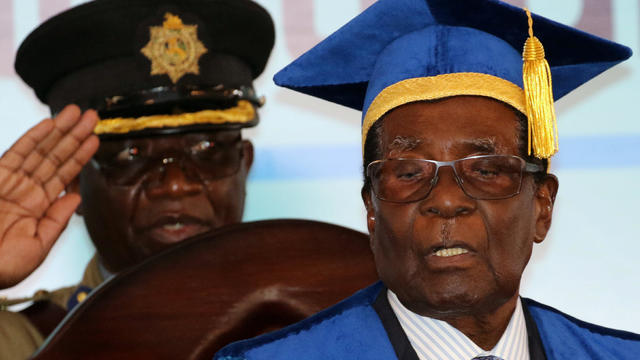 Zimbabwe President Robert Mugabe attends a university graduation ceremony in Harare 