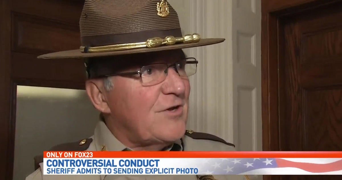 Sheriff admits to sending sexually explicit photo in uniform - CBS News