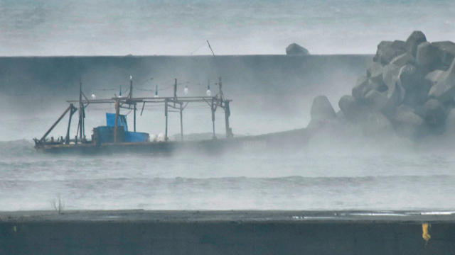 A wooden boat is seen in front of a breakwater in Yurihonjo, Japan 