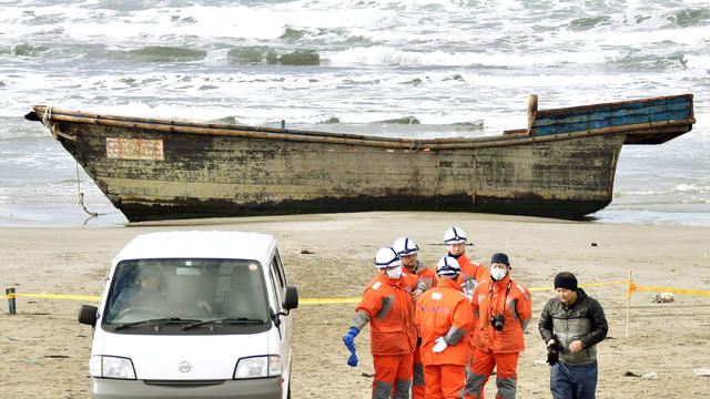 A wooden boat that drifted ashore with eight partially skeletal bodies and was found by Japan's coast guard is seen in Oga, Akita Prefecture, Japan, in this photo taken by Kyodo on Nov. 27, 2017. 