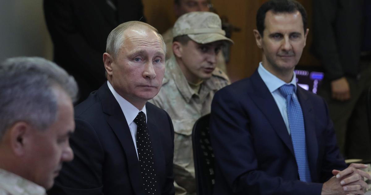 Vladimir Putin in Syria to declare victory, hug Bashar Assad and announce  partial Russia troops pullout - CBS News