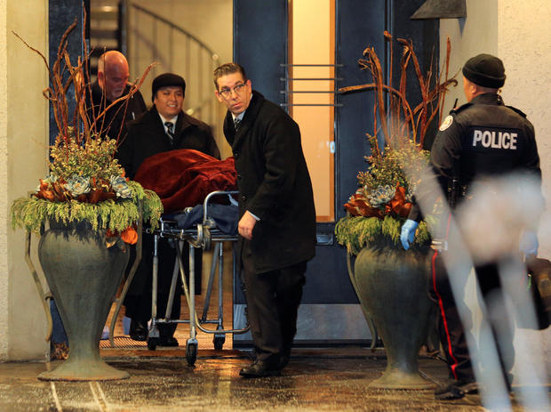 One of two bodies is removed from the home of billionaire founder of Canadian pharmaceutical firm Apotex in Toronto 