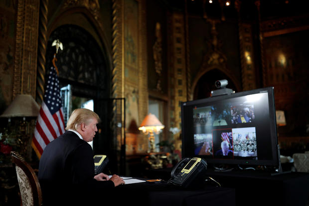 U.S. President Donald Trump participates in a Christmas Eve video teleconference with members of the military at Mar-a-Lago estate in Palm Beach, Florida 