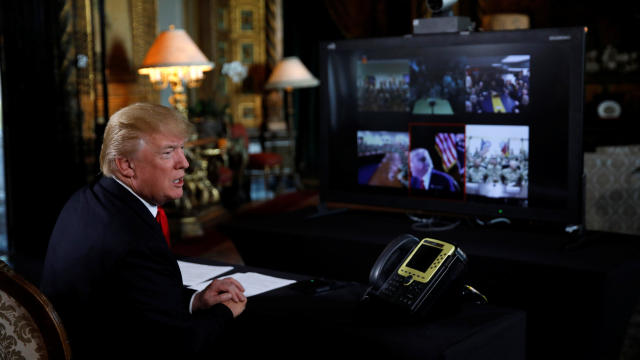 U.S. President Donald Trump participates in a Christmas Eve video teleconference with members of the military at Mar-a-Lago estate in Palm Beach, Florida 